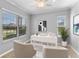 Bright office with a ceiling fan, desk, and windows providing ample natural light at 10502 Brentford Dr, Tampa, FL 33626