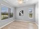 Bright office with a ceiling fan and two windows providing ample natural light at 10502 Brentford Dr, Tampa, FL 33626