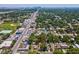 Aerial view showcasing the property with the city skyline in the distance at 106 W Louisiana Ave, Tampa, FL 33603