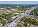A serene aerial view of a property nestled in a tree-lined neighborhood, near schools, retail and community features at 106 W Louisiana Ave, Tampa, FL 33603