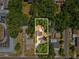 An aerial view showcasing the property, with the white border emphasizing its location amidst lush greenery at 106 W Louisiana Ave, Tampa, FL 33603
