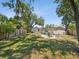 Spacious backyard featuring a fire pit with chairs and a wooden fence at 106 W Louisiana Ave, Tampa, FL 33603