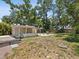 Extensive backyard featuring detached garage with covered patio at 106 W Louisiana Ave, Tampa, FL 33603