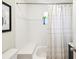 Bright bathroom features tile surround, built-in bench, and shower/tub combination at 106 W Louisiana Ave, Tampa, FL 33603