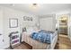 Bright bedroom with closet, updated fixtures, and an ensuite bathroom at 106 W Louisiana Ave, Tampa, FL 33603