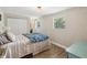 Bedroom with overhead lighting, natural light, closet, and hardwood flooring at 106 W Louisiana Ave, Tampa, FL 33603