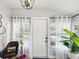 Inviting entryway with decorative lighting fixture and natural light at 106 W Louisiana Ave, Tampa, FL 33603