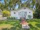 Charming home with a lush green lawn and lovely curb appeal at 106 W Louisiana Ave, Tampa, FL 33603