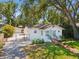 Charming home with a fenced parking area and lush front lawn at 106 W Louisiana Ave, Tampa, FL 33603