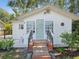 Exterior of home featuring nice front porch and landscaped front yard at 106 W Louisiana Ave, Tampa, FL 33603