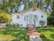 Well-maintained home with a brick walkway and tidy landscaping at 106 W Louisiana Ave, Tampa, FL 33603