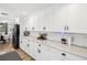 Bright kitchen boasting modern appliances, granite countertops, and crisp white cabinets at 106 W Louisiana Ave, Tampa, FL 33603