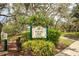 Sign for Rivercrest Park under a canopy of trees and foliage at 106 W Louisiana Ave, Tampa, FL 33603