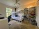 Shared bedroom featuring a bunk bed, shelving, and a study space with ample natural light at 10953 Winter Crest Dr, Riverview, FL 33569
