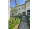 Inviting exterior view of a two-story home with well-maintained landscaping and a gated front entrance at 10953 Winter Crest Dr, Riverview, FL 33569