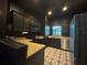 Stylish kitchen boasts granite counters, stainless appliances, and designer flooring at 10953 Winter Crest Dr, Riverview, FL 33569