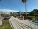A colorful playground area including a train and slide, protected by a shade sail, in this Gathering-friendly community at 10953 Winter Crest Dr, Riverview, FL 33569