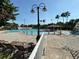 Community pool with splash park, lounge chairs and beautiful landscaping at 10953 Winter Crest Dr, Riverview, FL 33569