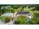 Aerial view of a beautiful club house, lush golf course and multiple ponds at 13038 Royal George Ave, Odessa, FL 33556