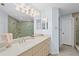 Bright bathroom with double mirrors, spacious countertop and step-in shower at 13038 Royal George Ave, Odessa, FL 33556