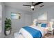 Bedroom with area rug, ceiling fan, and ensuite bathroom at 13038 Royal George Ave, Odessa, FL 33556
