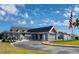 Exterior view of club house and a nicely kept driveway at 13038 Royal George Ave, Odessa, FL 33556