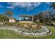 Welcome to The Eagles, a golf club and gated community with beautiful landscaping and a grand entrance at 13038 Royal George Ave, Odessa, FL 33556