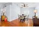 Charming dining area with hardwood floors, a ceiling fan, and ample natural light at 13038 Royal George Ave, Odessa, FL 33556