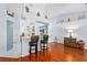 Bright and airy with hardwood floors, decorative letters above the kitchen at 13038 Royal George Ave, Odessa, FL 33556