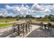 Outdoor dining patio with expansive views of the community's golf course at 13038 Royal George Ave, Odessa, FL 33556