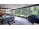 Spacious screened patio with a hot tub and outdoor seating, perfect for relaxing and entertaining at 13038 Royal George Ave, Odessa, FL 33556