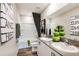 Stylish bathroom with dual sinks, modern fixtures, tub, and modern decor at 13040 Wellspring Dr, Lithia, FL 33547