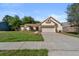 Charming home with a well-manicured lawn, mature trees, and an attached garage, offering great curb appeal at 1308 Peachfield Dr, Valrico, FL 33596