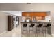 Open-concept kitchen with bar seating and views of the dining area at 1308 Peachfield Dr, Valrico, FL 33596