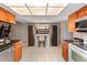 Bright kitchen with granite countertops, tile flooring, and stainless steel microwave at 1308 Peachfield Dr, Valrico, FL 33596