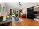 Cozy living room with hardwood floors, neutral walls, and a view of the backyard at 1308 Peachfield Dr, Valrico, FL 33596