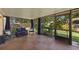 Relaxing screened patio with comfortable seating and views of the landscaped backyard at 1308 Peachfield Dr, Valrico, FL 33596