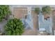 Aerial view of a home with a gray roof in a neighborhood with mature trees at 13218 Parkhurst Ct, Riverview, FL 33569