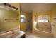Bathroom features a separate shower and tub, as well as tiled floors at 13218 Parkhurst Ct, Riverview, FL 33569