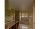 Neutral bathroom featuring a double sink vanity, bathtub, and shower at 13218 Parkhurst Ct, Riverview, FL 33569