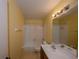 Bathroom features a bathtub with shower, linoleum flooring, and a vanity at 13218 Parkhurst Ct, Riverview, FL 33569