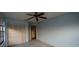 Comfortable bedroom with ceiling fan and closet at 13218 Parkhurst Ct, Riverview, FL 33569