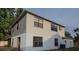 A view of the home's backyard and upper-story siding at 13218 Parkhurst Ct, Riverview, FL 33569