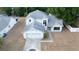 Two-story home featuring a gray roof, an attached two-car garage, and a traditional-style entrance at 13218 Parkhurst Ct, Riverview, FL 33569