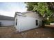 A view of the home's backyard and upper-story siding at 13218 Parkhurst Ct, Riverview, FL 33569