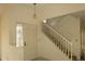 Bright foyer featuring a staircase leading to the second floor and a front door at 13218 Parkhurst Ct, Riverview, FL 33569
