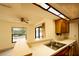 Kitchen featuring breakfast bar with double sink and view to the dining room and backyard at 13218 Parkhurst Ct, Riverview, FL 33569