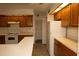 Spacious kitchen featuring white refrigerator, ample storage and essential appliances for culinary convenience at 13218 Parkhurst Ct, Riverview, FL 33569