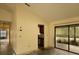 Open-concept living room featuring neutral walls, and access to kitchen and outdoor patio at 13218 Parkhurst Ct, Riverview, FL 33569