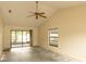 Spacious living room featuring a ceiling fan, neutral walls, and sliding glass doors at 13218 Parkhurst Ct, Riverview, FL 33569